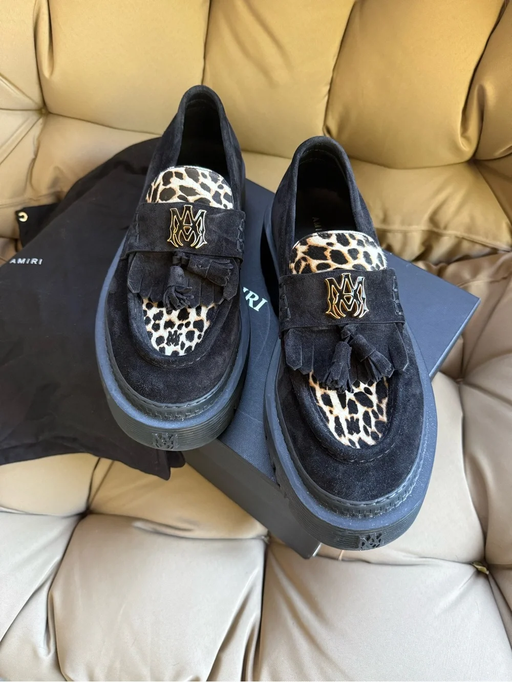 AMIRI Black Suede Tassel Loafers with Leopard Accent and Gold Crest